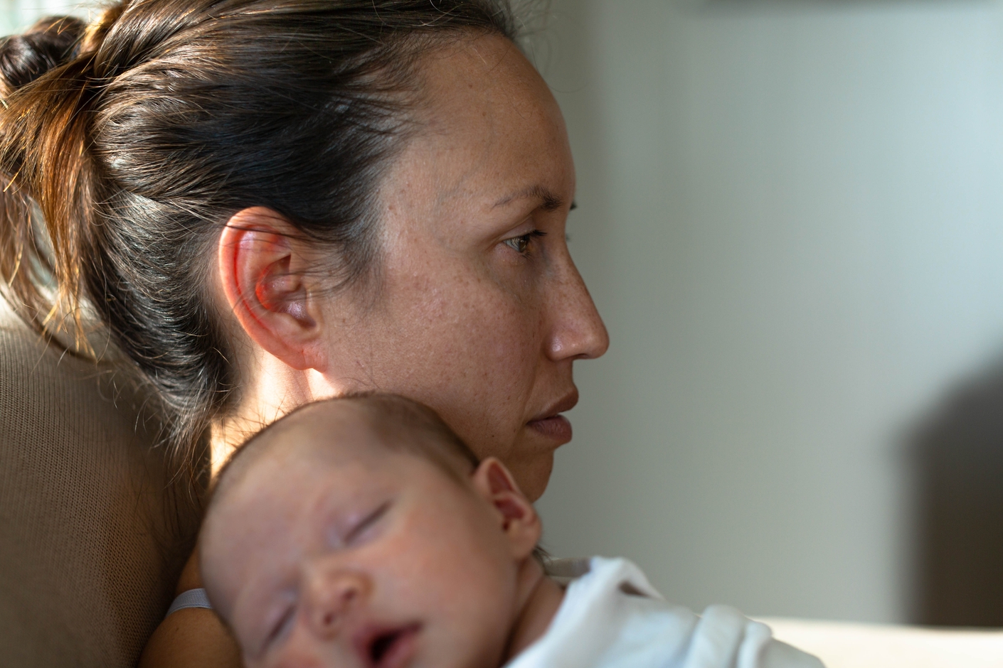 A,Sad,Mother,Sitting,At,Home,Suffering,From,Postpartum,Depression.