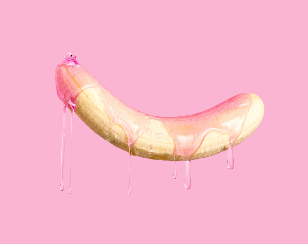 Peeled,Banana,Dripping,Pink,Gel,On,Pink,Background.
